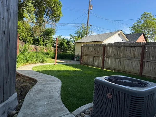 a backyard of a house with lots of green space