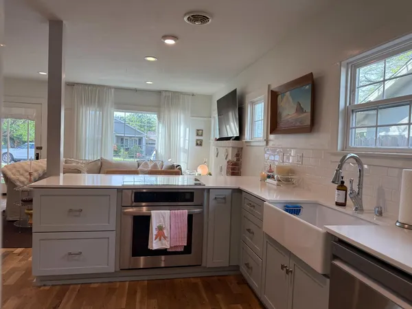 a kitchen with a sink and cabinets