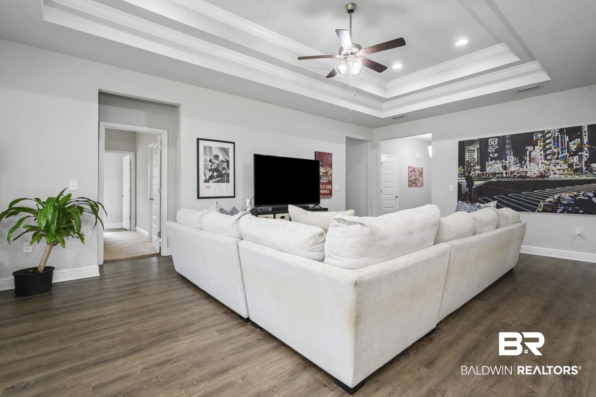 12693 Waxwing Avenue Daphne, AL 36527 - Photo 17 of 43 Living room with ornamental molding, a ceiling fan, dark wood finished floors, recessed lighting, and a raised ceiling