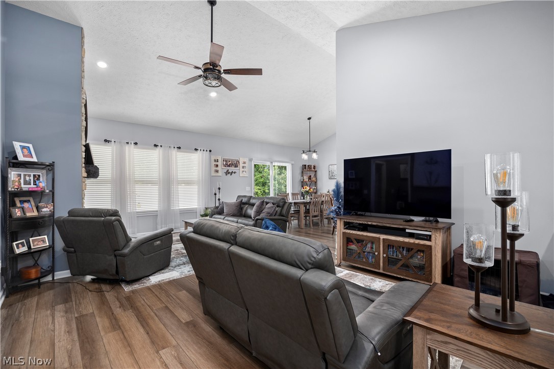 109 West Spring Drive Elyria, OH 44035 - Photo 5 of 46 Open-concept living area with vaulted ceilings and wood-finish flooring