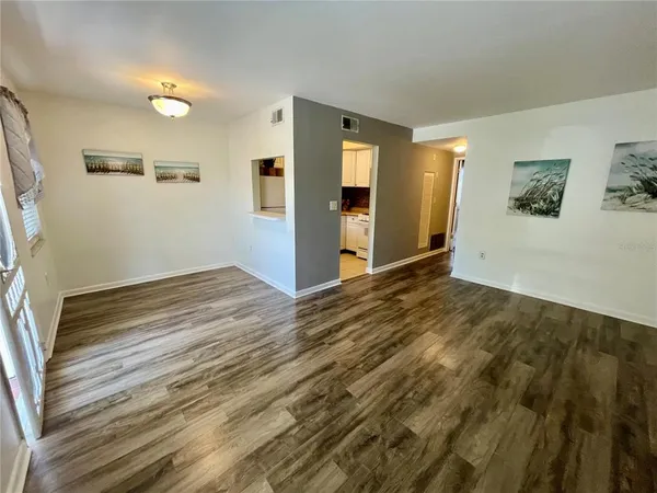 a view of wooden floor and brick walls