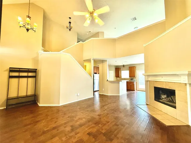 a view of a living room with a fireplace