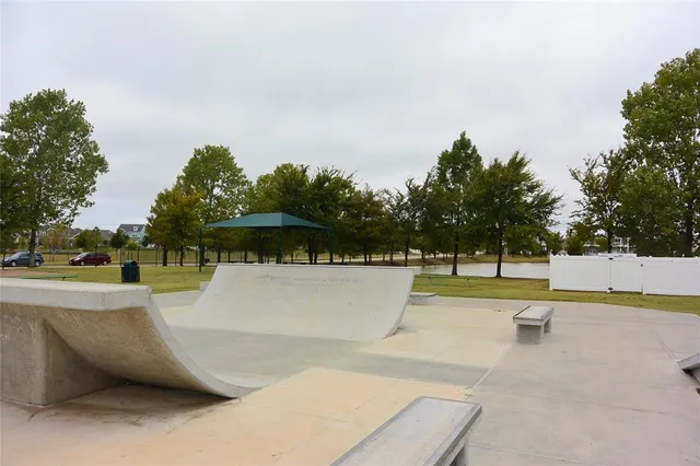 a view of a swimming pool and a yard