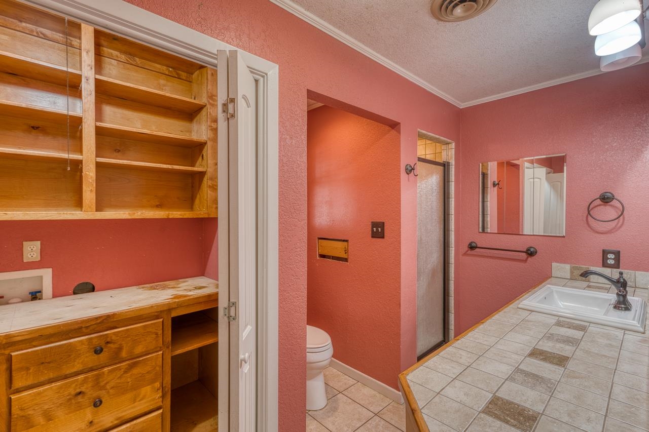 207 Princess Terrace Sunrise Beach, TX 78643 - Photo 13 of 25 a bathroom with a sink and a mirror