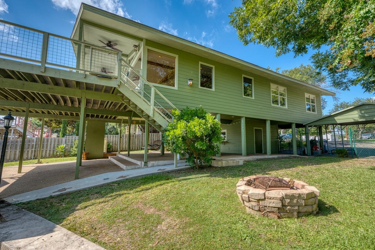 207 Princess Terrace Sunrise Beach, TX 78643 - Photo 18 of 25 a front view of a house with a yard