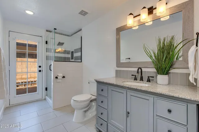 a bath tub sitting next to a bathroom sink