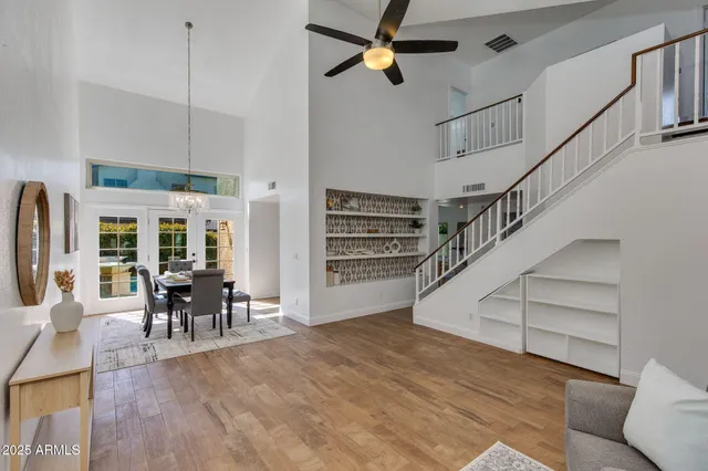 a view of dining room with furniture chandelier and wooden floor
