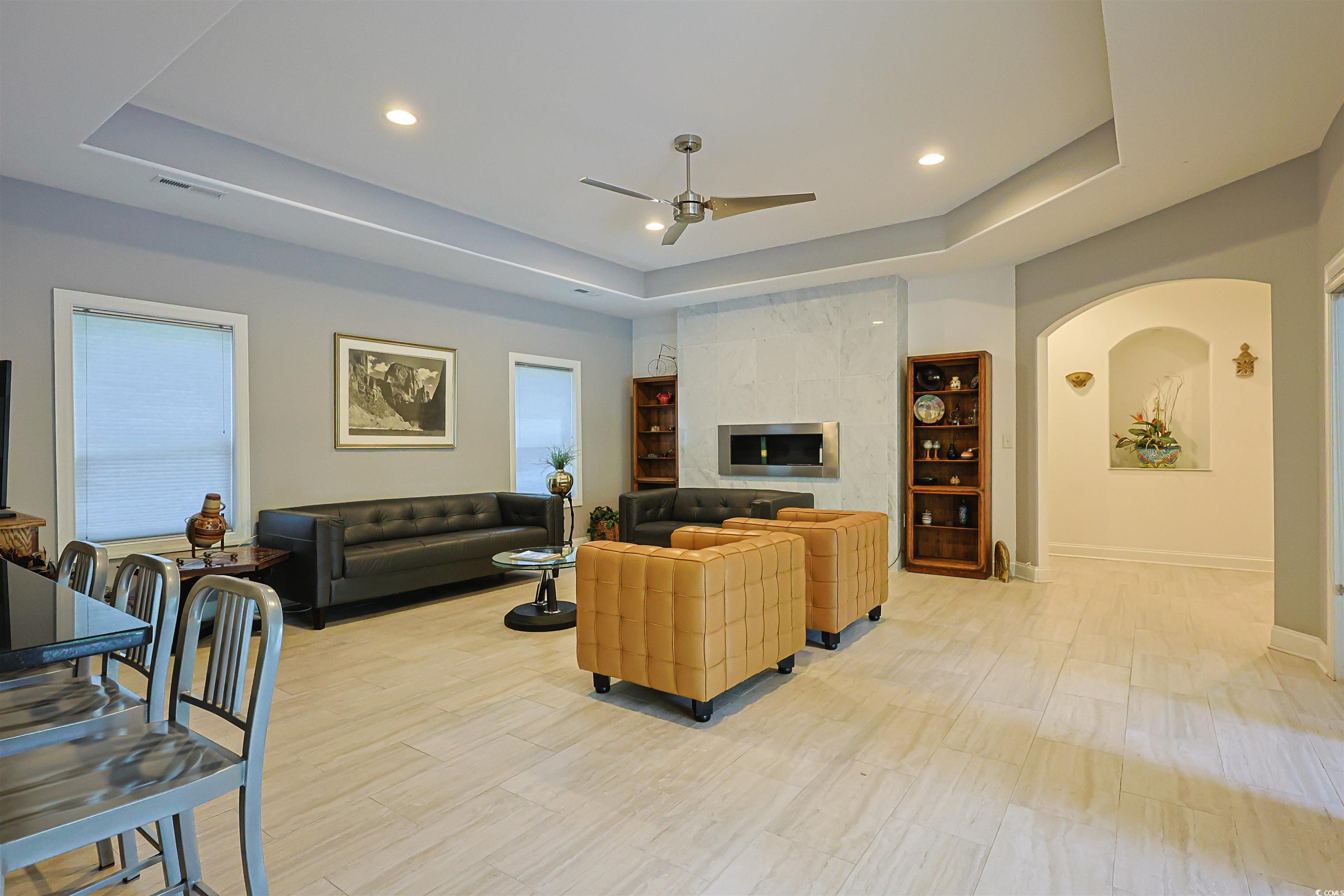1065 Wigeon Drive Conway, SC 29526 - Photo 2 of 40 Living area featuring a raised ceiling, light wood finished floors, recessed lighting, a tile fireplace, and ceiling fan