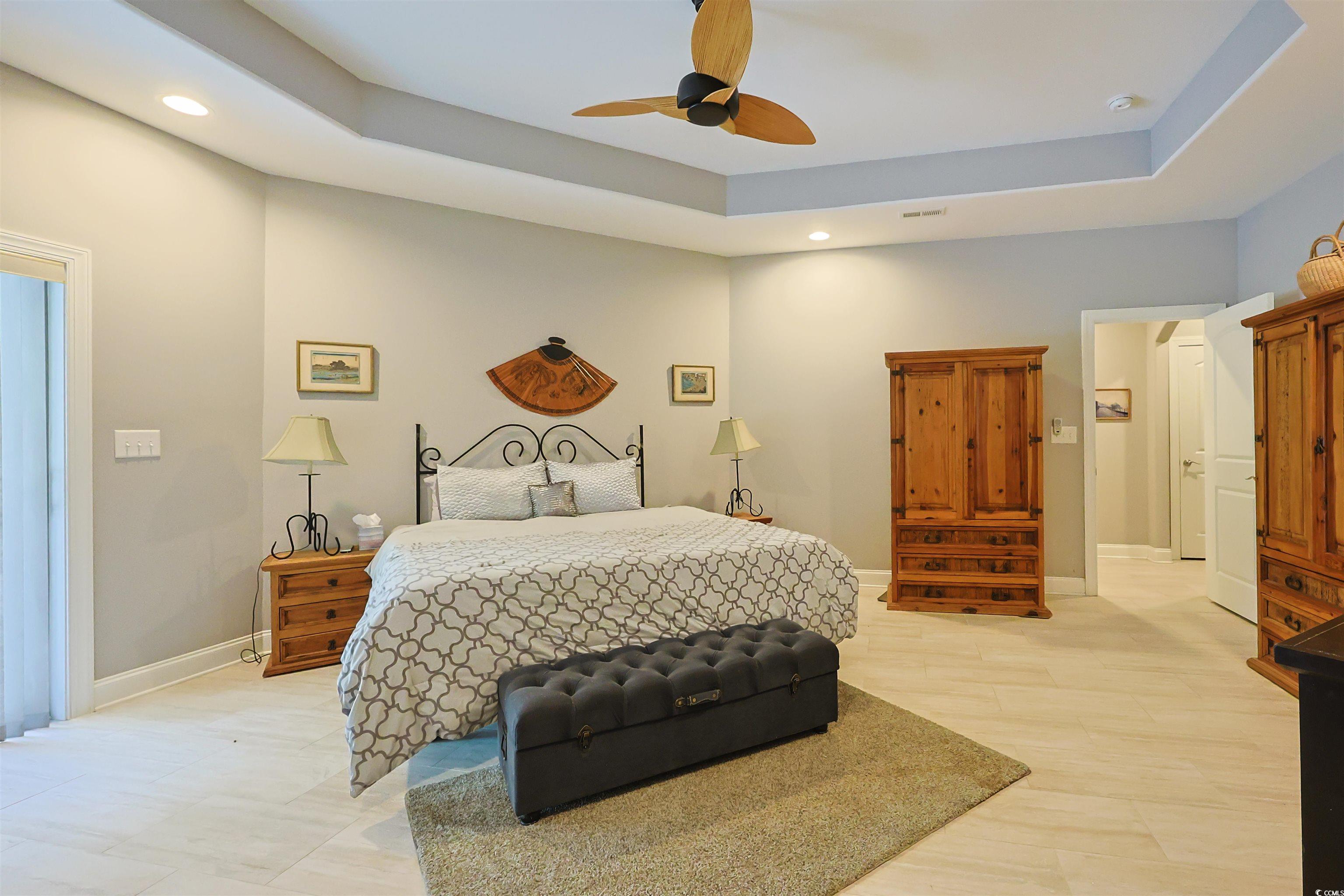 1065 Wigeon Drive Conway, SC 29526 - Photo 9 of 40 Bedroom featuring a tray ceiling, a ceiling fan, recessed lighting, and light wood-style floors