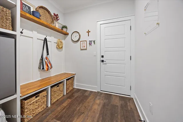 a view of hallway with wooden floor