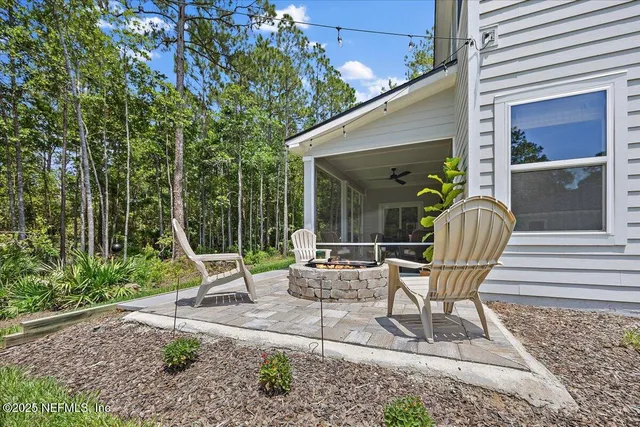 a view of a chair and tables in the patio