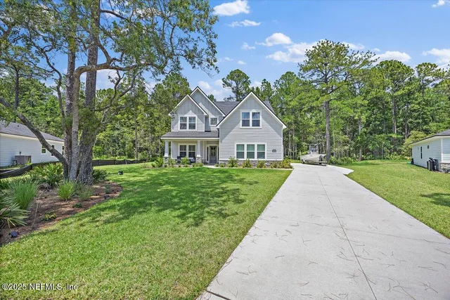 a front view of a house with yard
