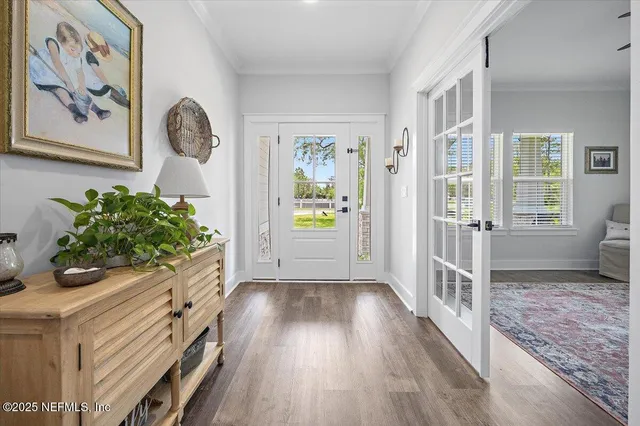 a view of entryway with wooden floor