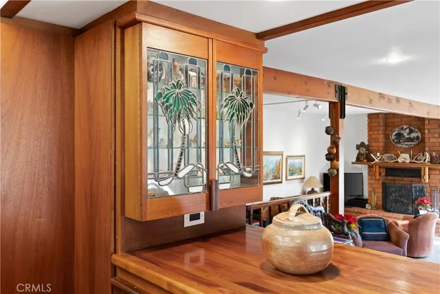 a dining room with furniture a rug and wooden floor
