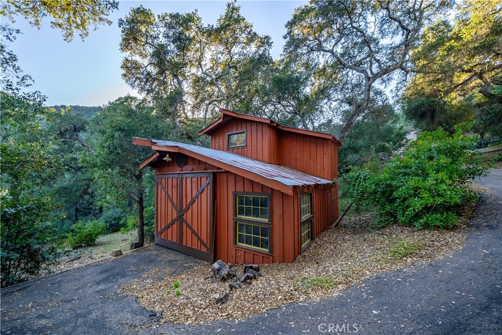 4411 See Canyon Road San Luis Obispo, CA 93405 - Photo 2 of 75 a view of a small house with a yard next to a road