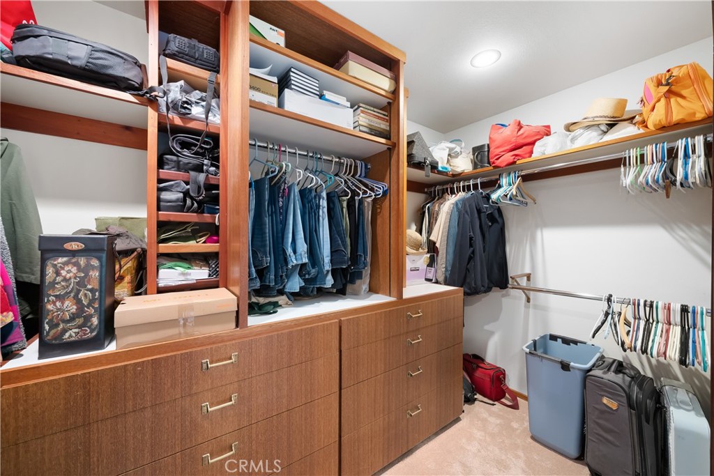 4411 See Canyon Road San Luis Obispo, CA 93405 - Photo 23 of 75 a view of walk in closet with clothes and shoes