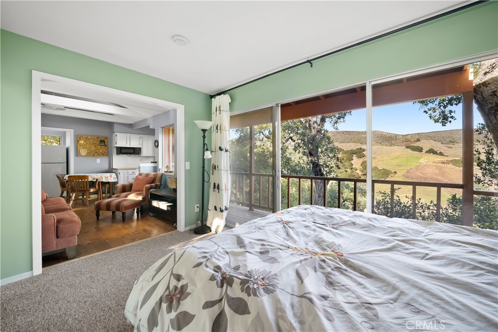 4411 See Canyon Road San Luis Obispo, CA 93405 - Photo 52 of 75 a bedroom with a bed and a large window