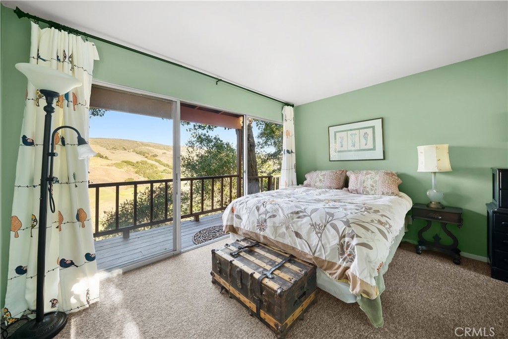 4411 See Canyon Road San Luis Obispo, CA 93405 - Photo 53 of 75 a spacious bedroom with a bed and a large window