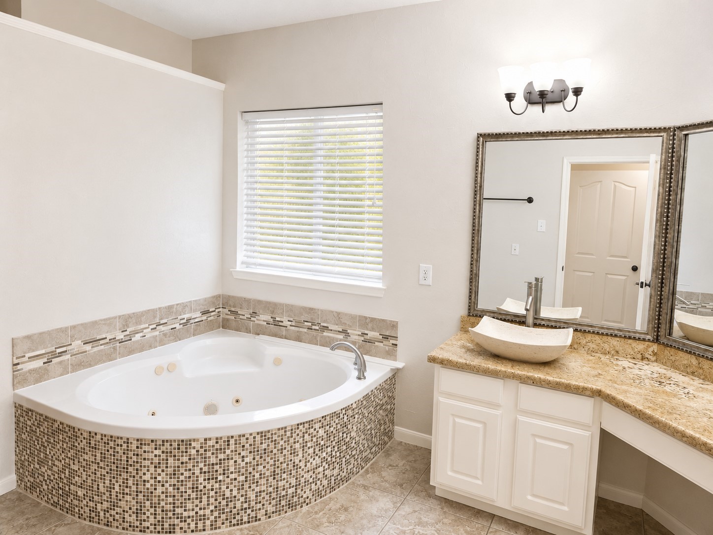 20203 Timberstone Lane Spring, TX 77379 - Photo 13 of 23 The bathroom features double sinks, a relaxing jetted tub, and a separate shower—creating a true retreat experience.