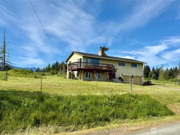 a view of a house with a big yard