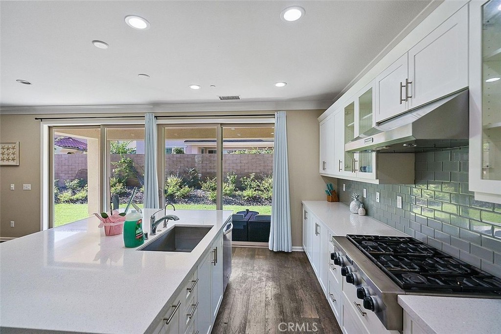 217 Compass Irvine, CA 92618 - Photo 13 of 34 a kitchen with stainless steel appliances a stove a sink and a refrigerator