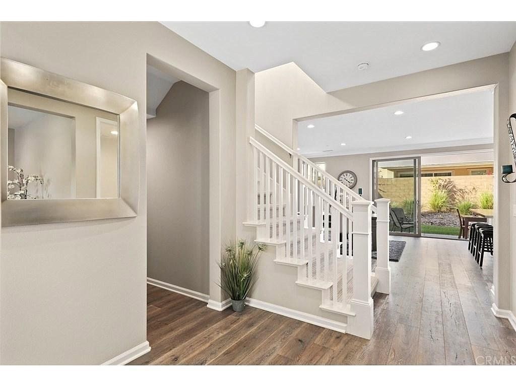 217 Compass Irvine, CA 92618 - Photo 14 of 34 a living room with furniture and a wooden floor