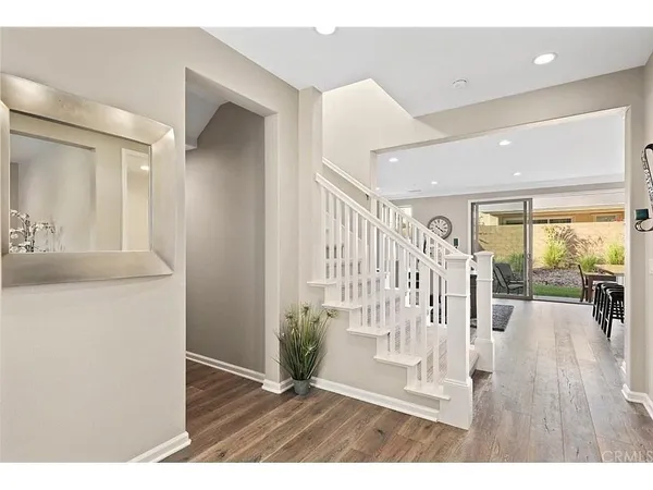 a large white bathroom with a sink a mirror and a shower