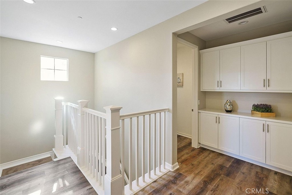 217 Compass Irvine, CA 92618 - Photo 15 of 34 a view of a kitchen with wooden floor