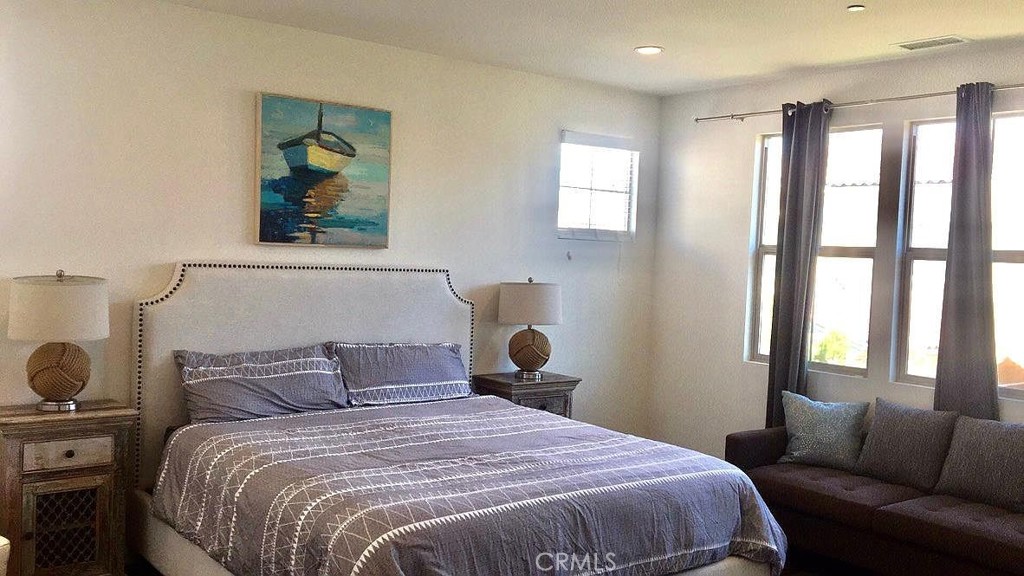 217 Compass Irvine, CA 92618 - Photo 16 of 34 a bedroom with a bed and a couch