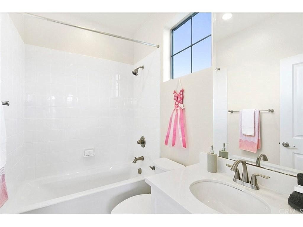 217 Compass Irvine, CA 92618 - Photo 18 of 34 a bathroom with a bathtub and a sink