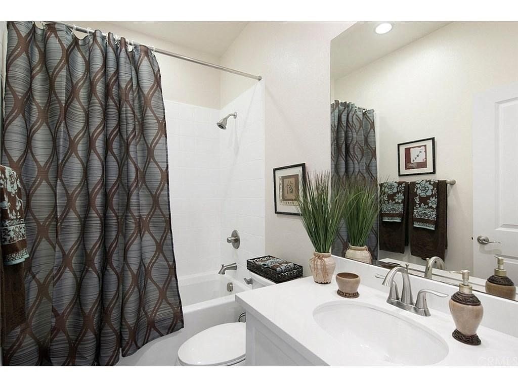 217 Compass Irvine, CA 92618 - Photo 19 of 34 a bathroom with a sink and a mirror