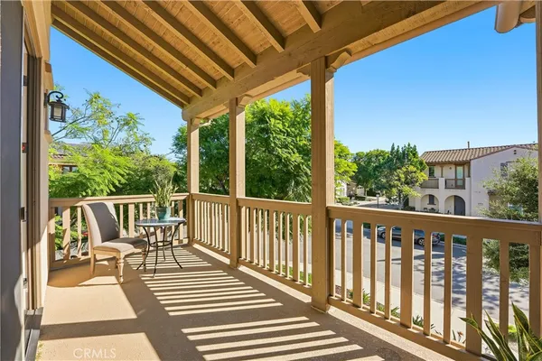 a view of a kitchen with kitchen island a sink dishwasher a refrigerator and wooden floor
