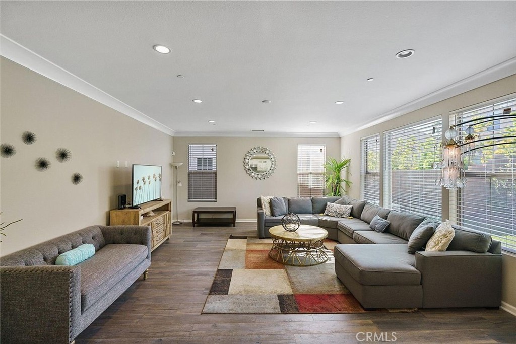 217 Compass Irvine, CA 92618 - Photo 3 of 34 a living room with furniture wooden floor and a large window