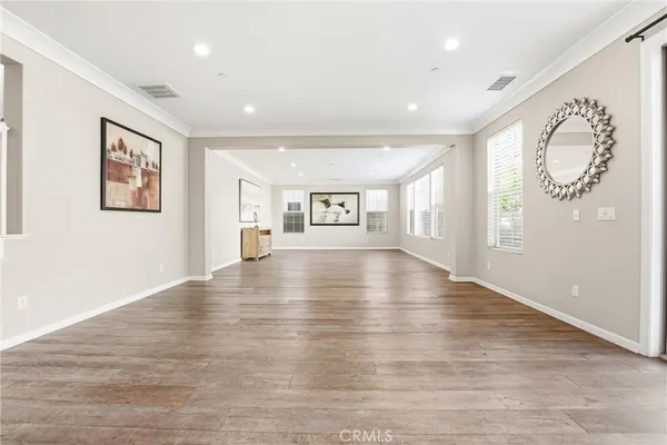 a spacious bathroom with a sink a mirror a bathtub and window