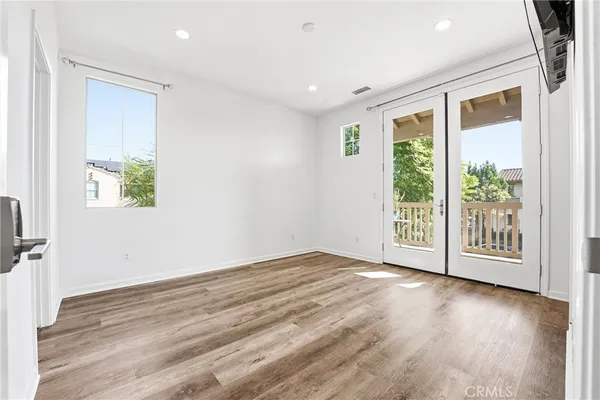 a view of a street with a tree