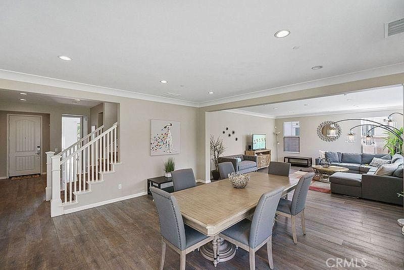 217 Compass Irvine, CA 92618 - Photo 10 of 34 a view of a dining room with furniture window and wooden floor