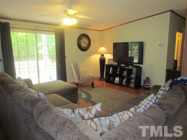 109 Medlin Road Rougemont, NC 27572 - Photo 13 of 19 a living room with furniture and a flat screen tv
