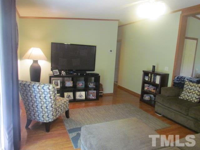 109 Medlin Road Rougemont, NC 27572 - Photo 14 of 19 a living room with furniture and a flat screen tv