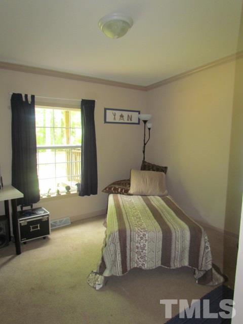 109 Medlin Road Rougemont, NC 27572 - Photo 16 of 19 a bedroom with a bed and a window