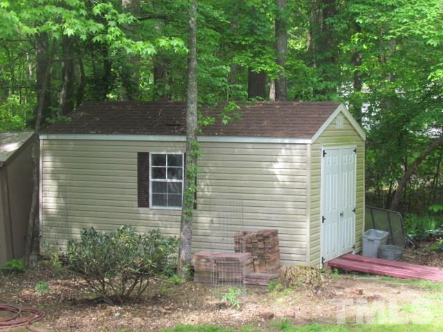 109 Medlin Road Rougemont, NC 27572 - Photo 18 of 19 a front view of a house with garden