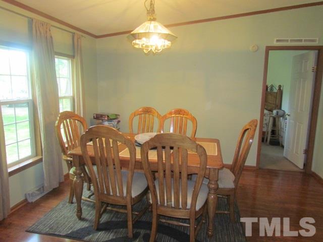 109 Medlin Road Rougemont, NC 27572 - Photo 8 of 19 a view of a dining room with furniture and chandelier