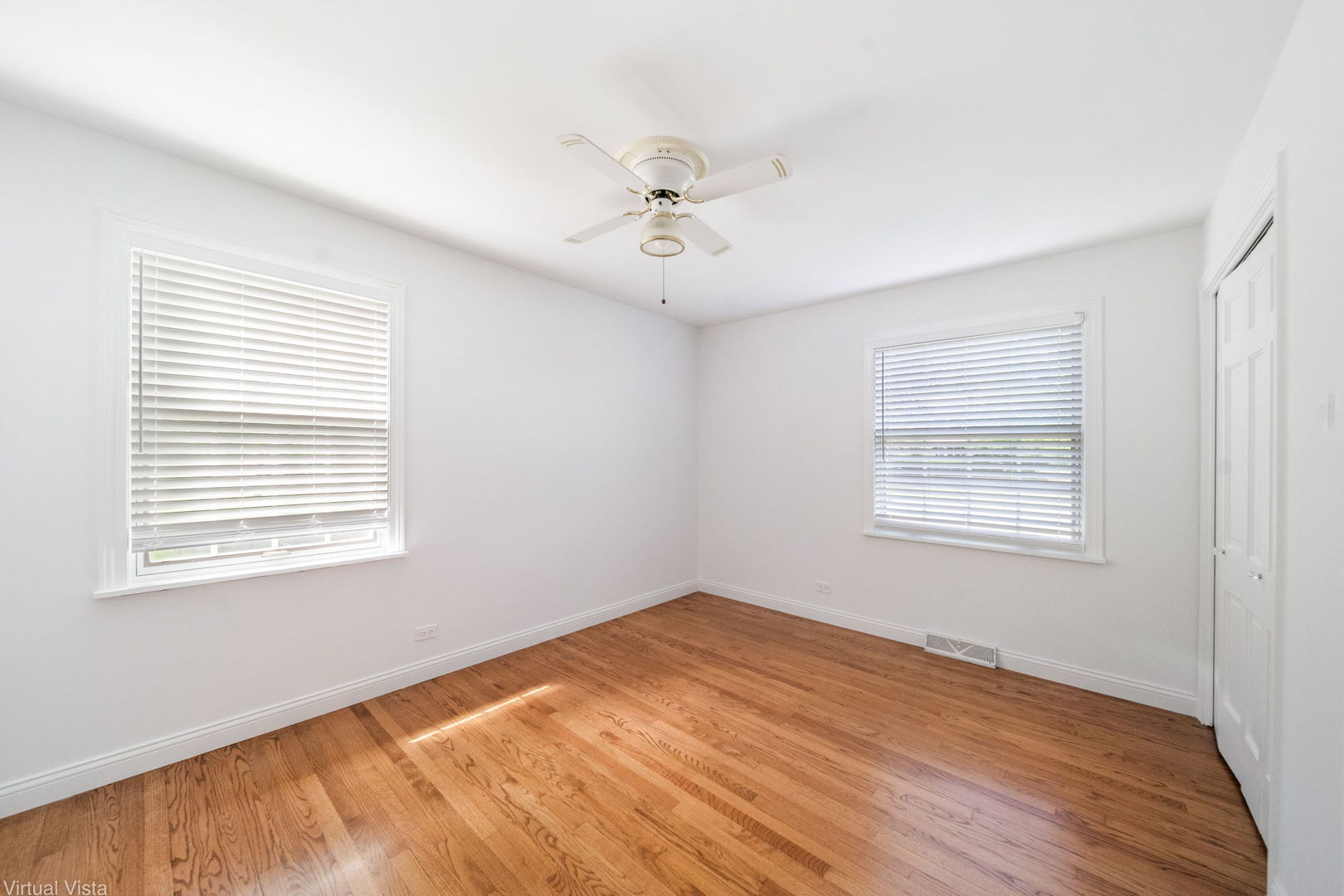 449 Ohio Road Frankfort, IL 60423 - Photo 13 of 25 a view of an empty room with wooden floor and a window