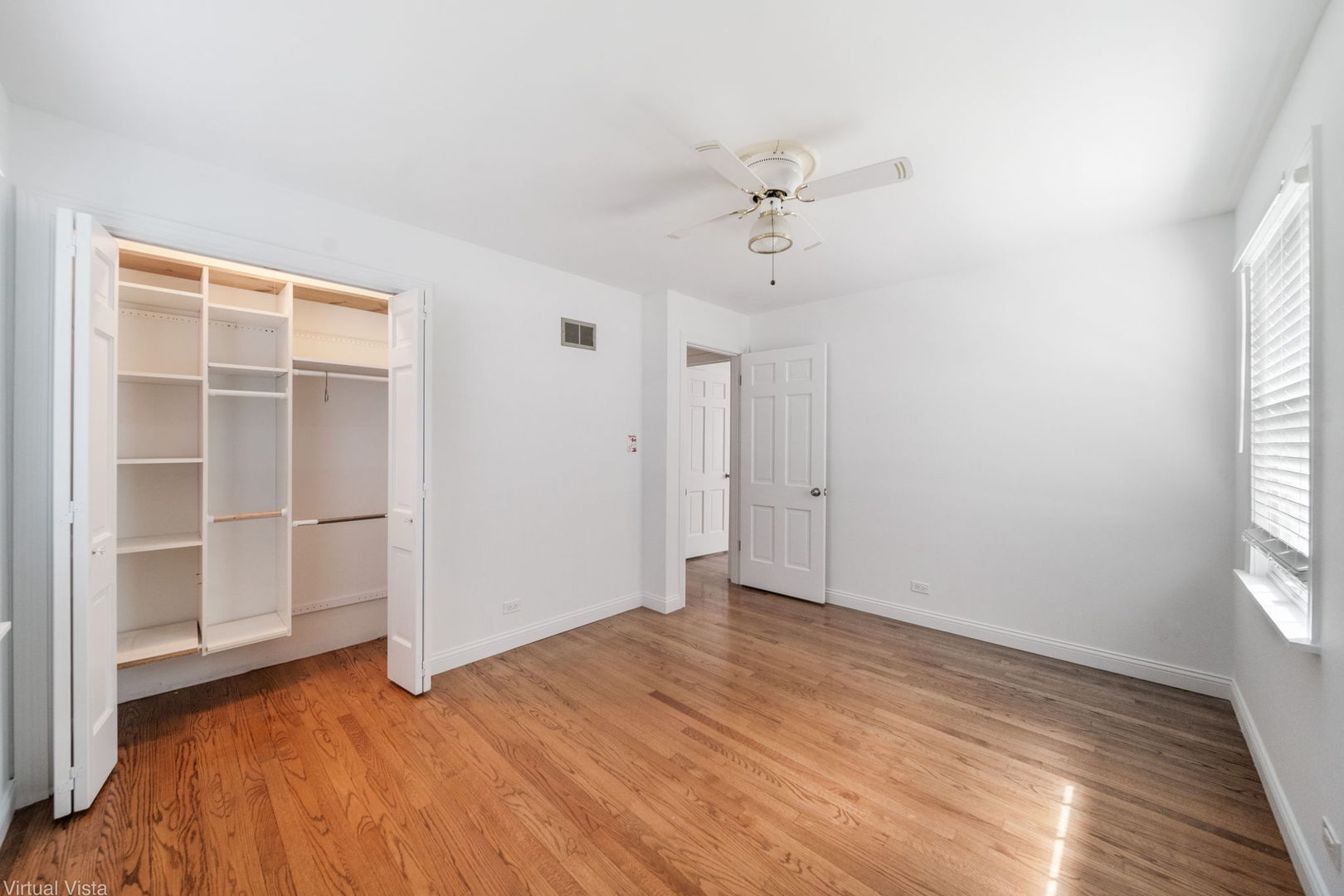 449 Ohio Road Frankfort, IL 60423 - Photo 14 of 25 wooden floor in an empty room with a window