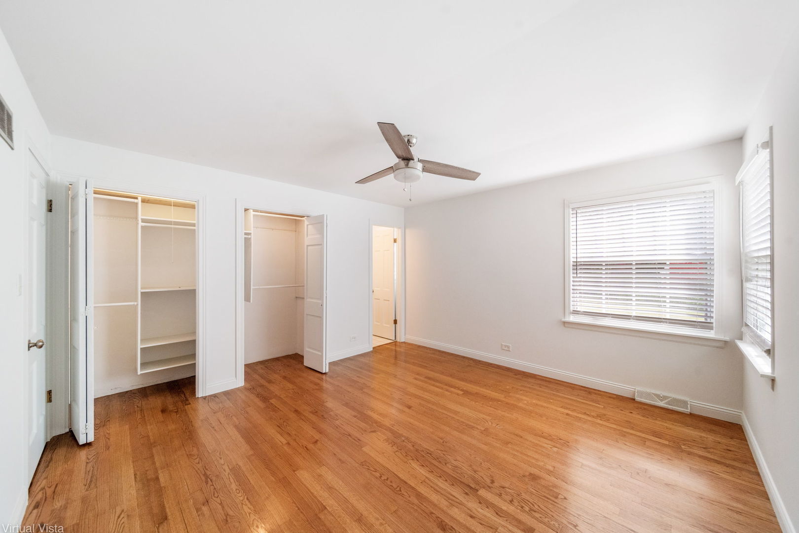 449 Ohio Road Frankfort, IL 60423 - Photo 18 of 25 a view of empty room with wooden floor and fan