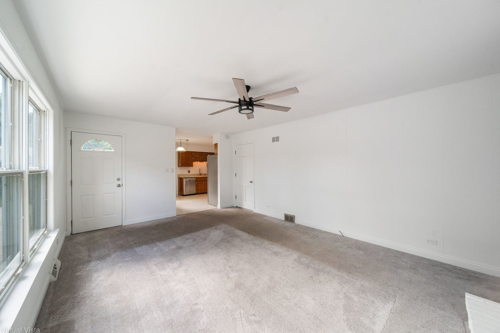 449 Ohio Road Frankfort, IL 60423 - Photo 6 of 25 a view of a livingroom with a ceiling fan and window