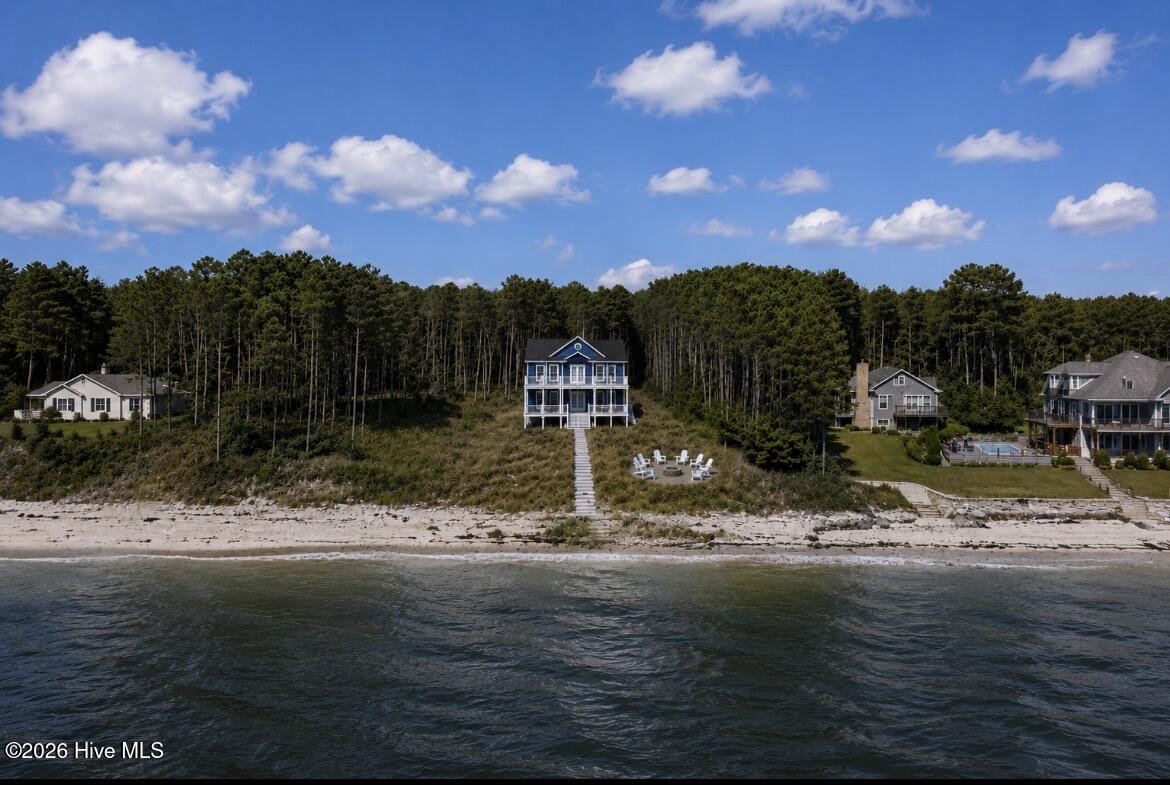 558 Sandy Point Drive Beaufort, NC 28516 - Photo 22 of 23 This is a rendering of a home on the lot, it is an AI image of what is possible.