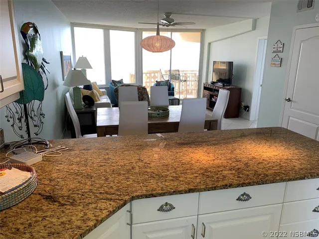 a table with a vase and flowers on it