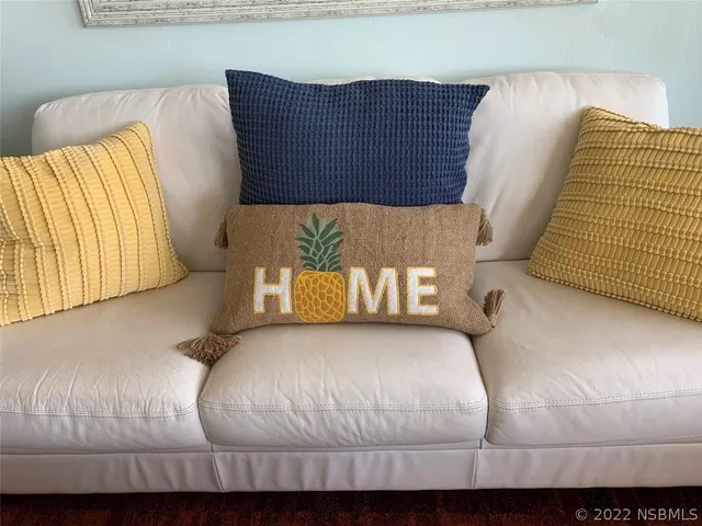 a living room with a fireplace and a flat screen tv