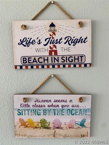 a bedroom with a bed and large windows