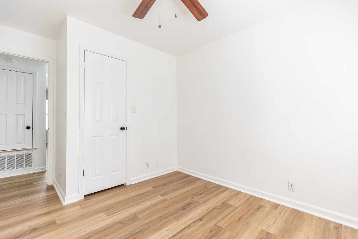 2012 Balsam Way Round Rock, TX 78665 - Photo 16 of 30 Unfurnished room featuring light wood-style flooring and a ceiling fan